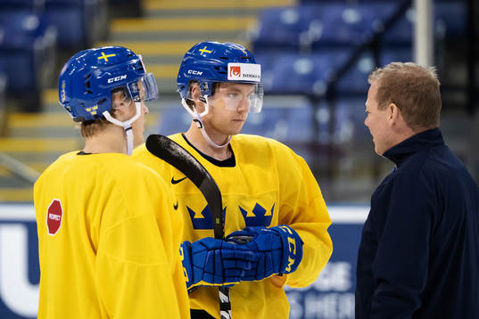Adam Boqvist, Rasmus Sandin and assistant coach Henrik