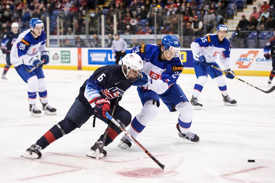 Jack Hughes of USA challenges Michal Ivan of Slovakia