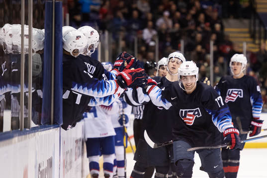 Evan Barratt of USA celebrates with teammates