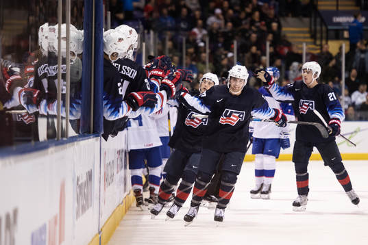 Evan Barratt of USA celebrates with teammates