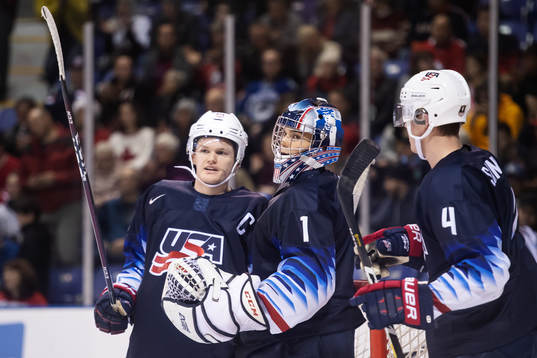 Mikey Anderson, goaltender Kyle Keyser and Dylan Samberg of