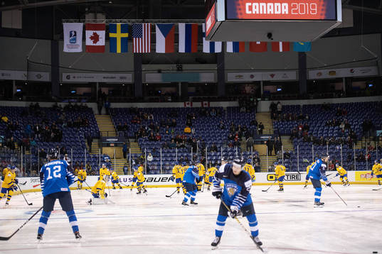 Players of team Sweden and Finland warming up