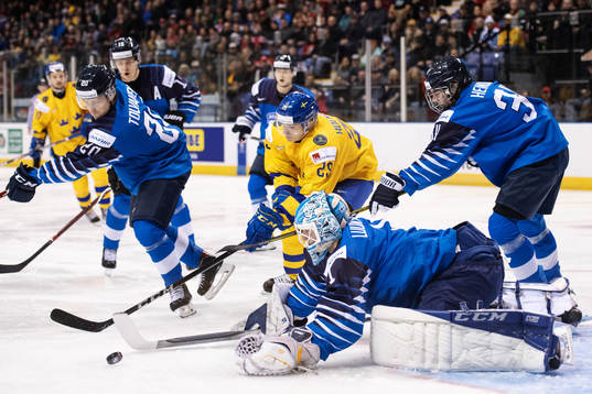 Eeli Tolvanen, goaltender Ukko-Pekka Luukkonen and Ville