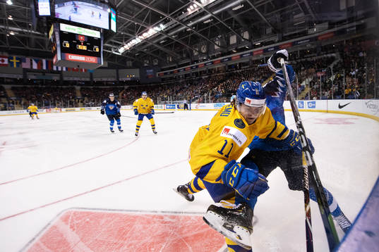 Samuel Fagemo of Sweden tackles Oskari Laaksonen of Finland