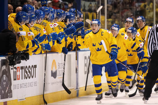 Erik Brännström of Sweden celebrates with teammates