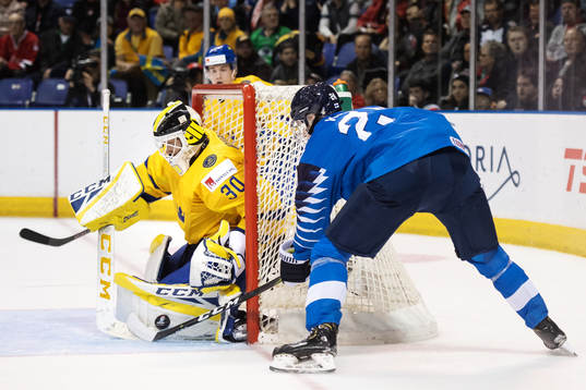 Goaltender Samuel Ersson of Sweden and Kaapo Kakko of