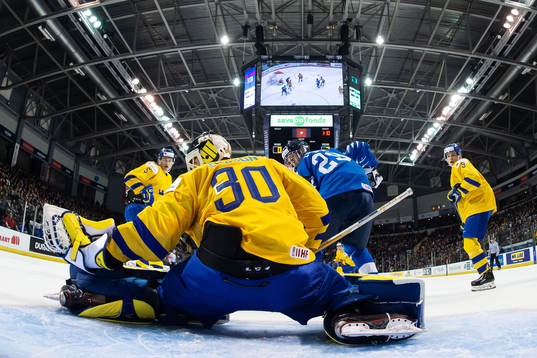 Goaltender Samuel Ersson of Sweden makes a save