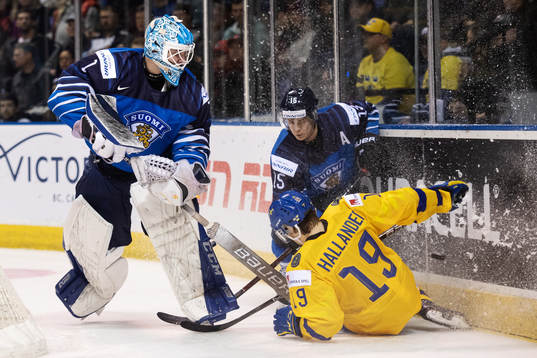 Goaltender Ukko-Pekka Luukkonen and Henri Jokiharju of
