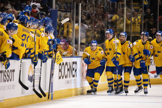 Erik Brännström (#12) of Sweden celebrates with teammates