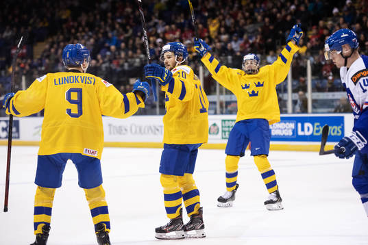 Emil Bemström (C) of Sweden celebrates