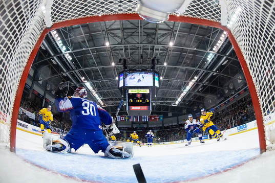 Lucas Elvenes of Sweden scores 0-1 behind goaltender Juraj