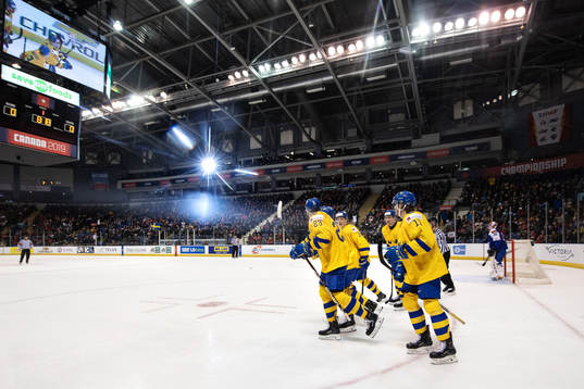 Lucas Elvenes (L) of Sweden celebrates with teammates