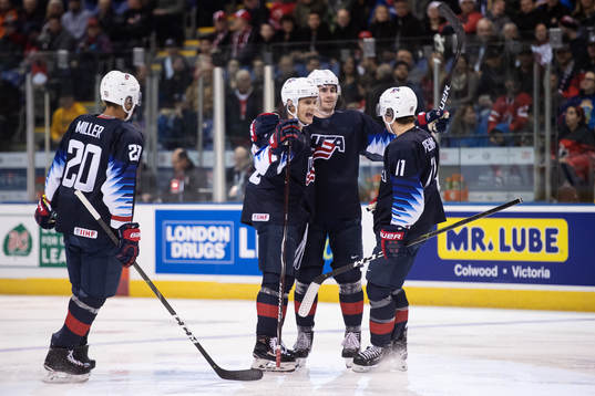 Oliver Wahlstrom (C) of USA celebrates with teammates