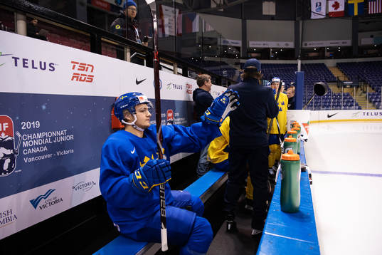 Erik Brännström of team Sweden throws a puck