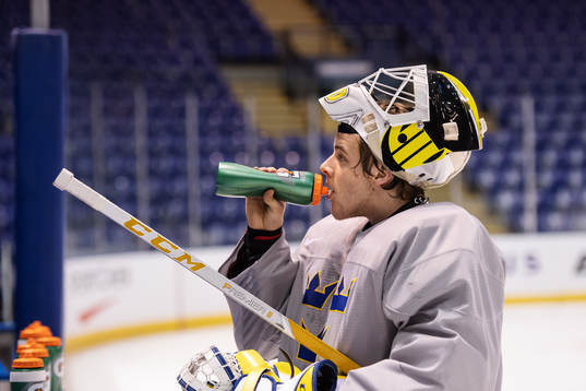 Goaltender Samuel Ersson of team Sweden drinks water at a