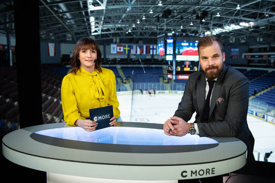 TV commentators Lena Sundqvist and Sanny Lindström in the