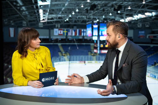 TV commentators Lena Sundqvist and Sanny Lindström in the