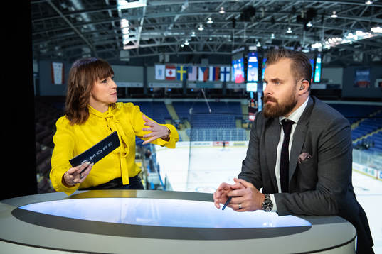 TV commentators Lena Sundqvist and Sanny Lindström in the