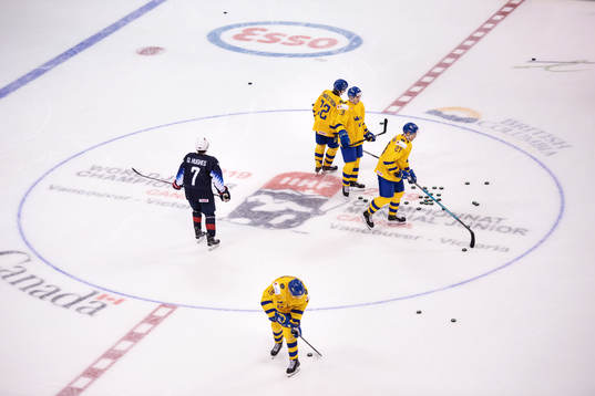 Quinn Hughes of USA and Rasmus Sandin, Isac Lundeström,