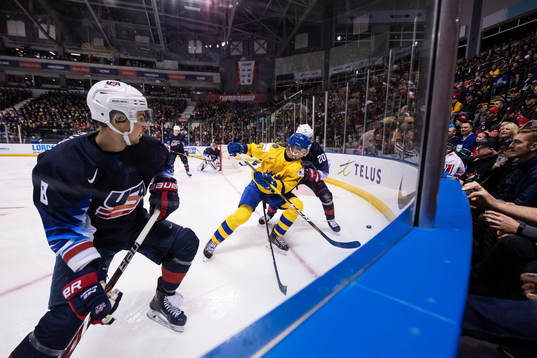 Alexander Chmelevski and K'Andre Miller of USA in action
