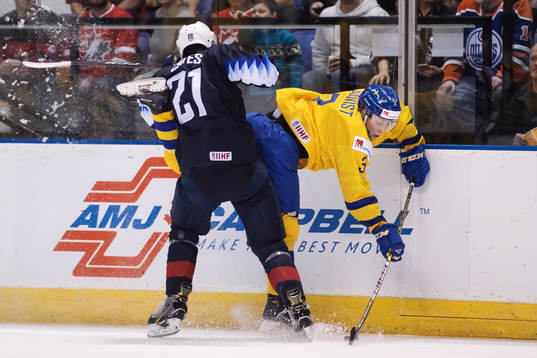 Noah Cates of USA tackles Adam Boqvist of Sweden