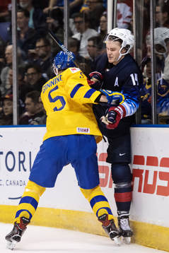 Adam Ginning of Sweden tackles Josh Norris of USA