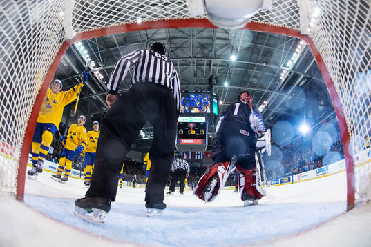 Swedish players celebrate the game winning 5-4 goal from
