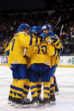 Erik Brännström of Sweden celebrates with teammates