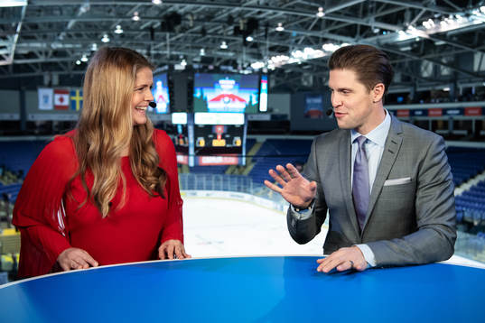 TV commentators Marie Lehmann and Jonas Andersson in the