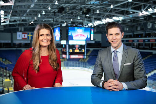 TV commentators Marie Lehmann and Jonas Andersson in the