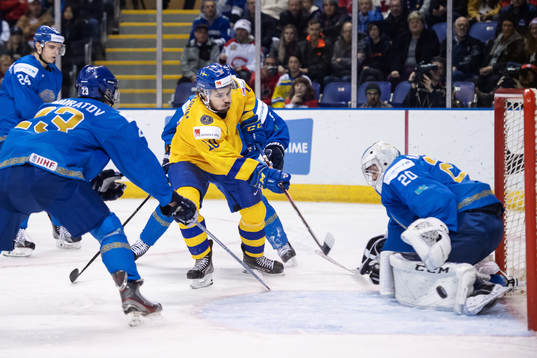 Emil Bemström of Sweden shoots at goaltender Denis