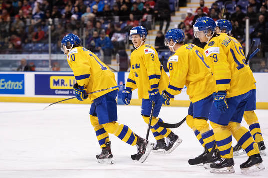 Emil Bemström (L) of Sweden celebrates with teammates