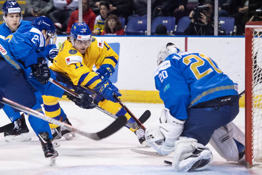 Samuel Fagemo of Sweden in action against goaltender Denis