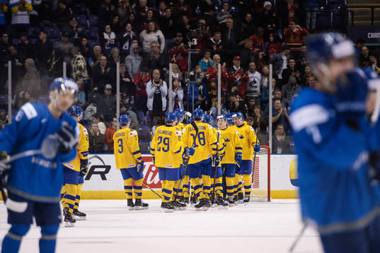 Players of team Sweden celebrate their win