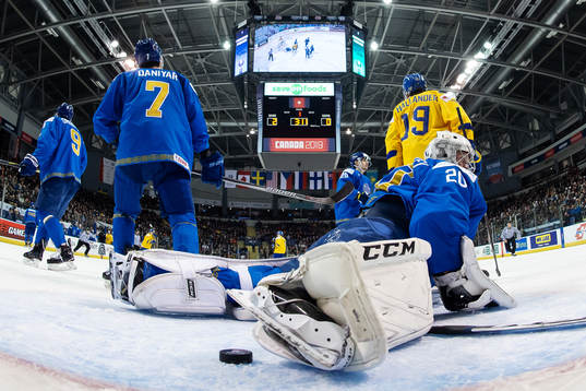 Goaltender Denis Karatayev of Kazakhstan looks dejected