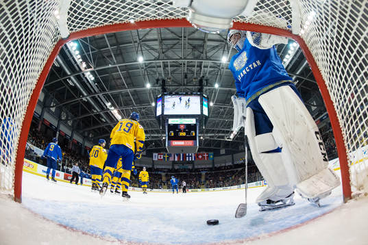 Goaltender Denis Karatayev of Kazakhstan looks dejected