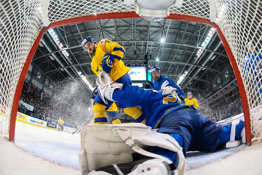Goaltender Denis Karatayev of Kazakhstan stops the puck in