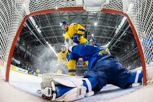 Goaltender Denis Karatayev of Kazakhstan stops the puck in