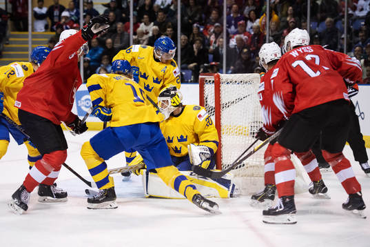 Goaltender Samuel Ersson of Sweden lets in the 0-2 goal