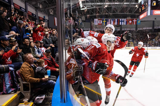 Luca Wyss of Switzerland celebrates with teammates
