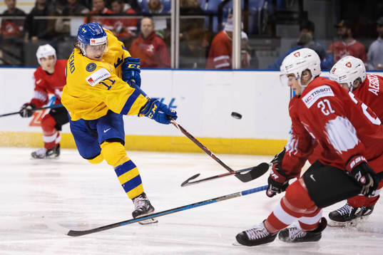 Samuel Fagemo of Sweden shoots the puck