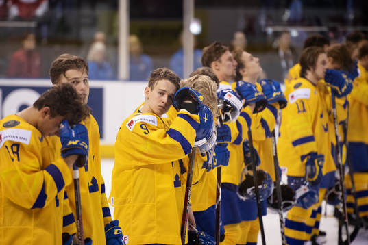 Nils Lundkvist of Sweden and his teammates look dejected