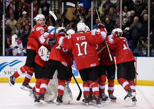 Players of Switzerland celebrate their win