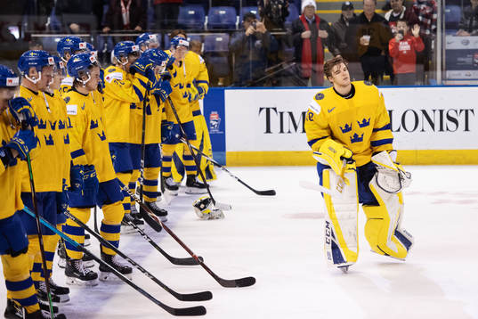 Goaltender Samuel Ersson of Sweden looks dejected