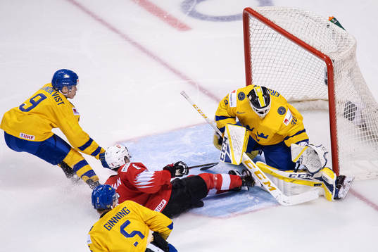 Nils Lundkvist, Adam Ginning and goaltender Samuel Ersson