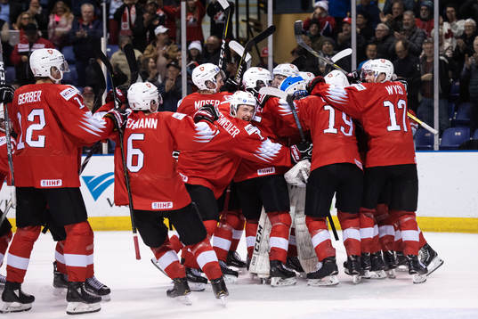 Players of Switzerland celebrate their win