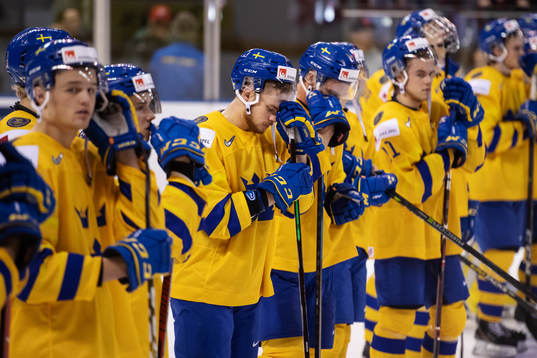 Lucas Elvenes of Sweden and his teammates look dejected