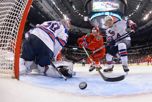 Russia's Ivan Muranov #23 races USA's Phil Kemp #25 for the