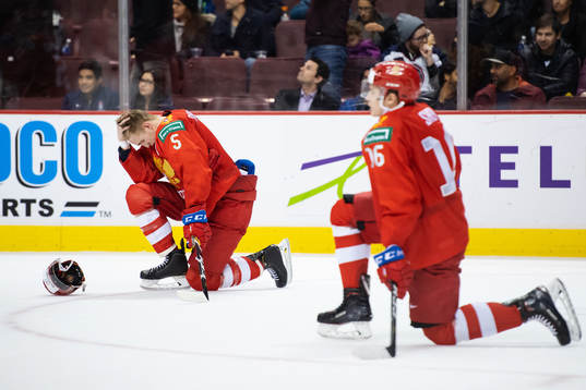 Dmitri Samorukov and Pavel Shen of Russia look dejected