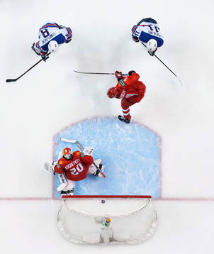 Alexander Chmelevski of USA scores 0-2 behind goaltender